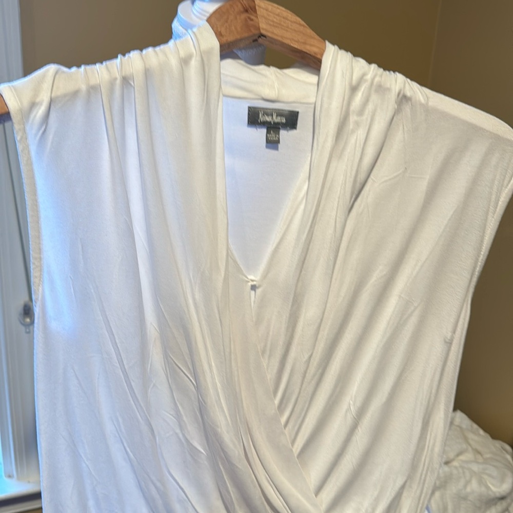 White sleeveless body suit top.